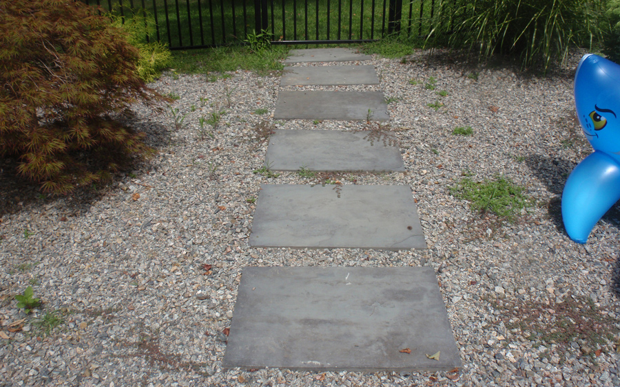 Sidewalk and patio installation complementing a home's exterior